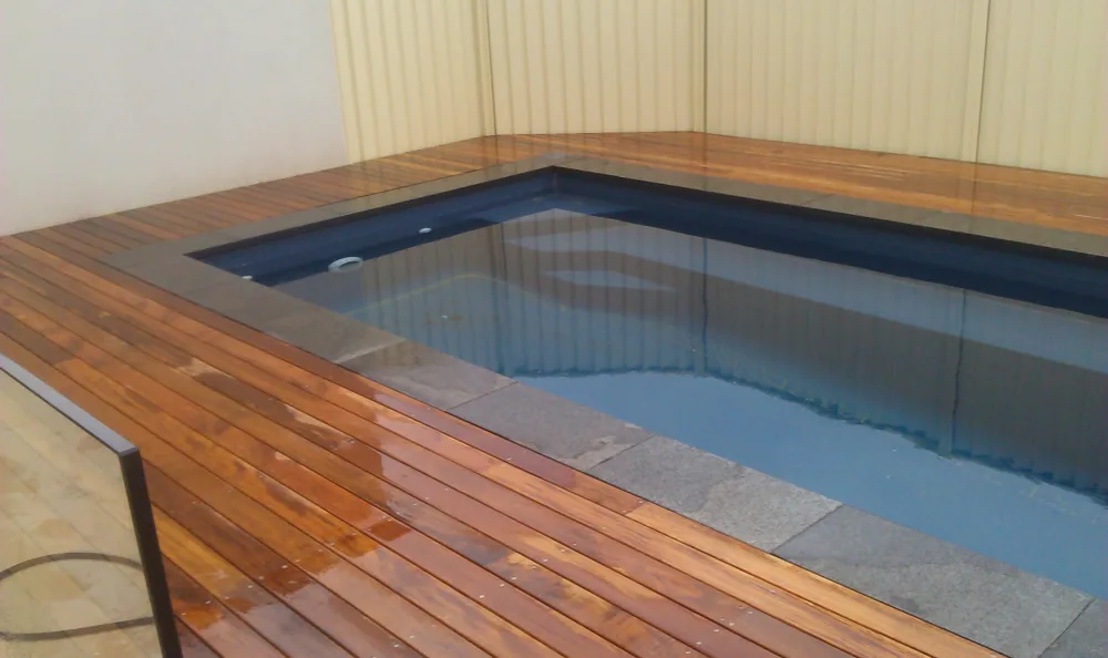 Hardwood deck built around a plunge pool, a Seaforth Builders project on the Gold Coast