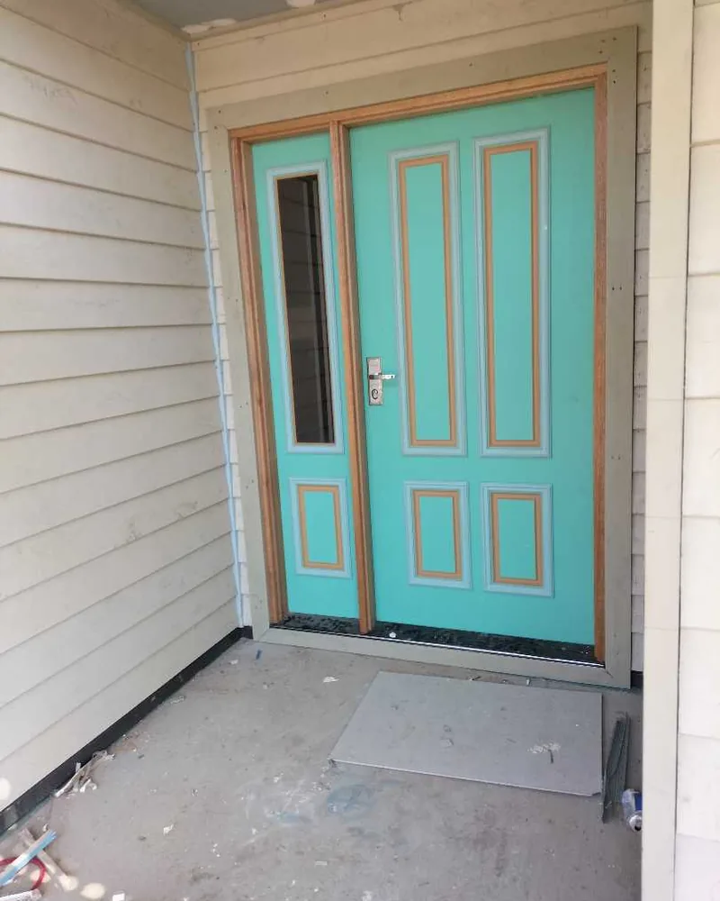 Entry door with new exterior cladding around the opening, a Seaforth Builders project on the Gold Coast
