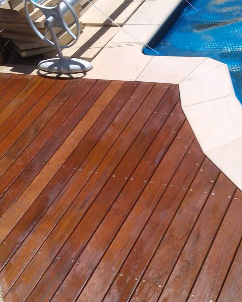 Curved timber pool deck following the edge of a pool, a Seaforth Builders project on the Gold Coast